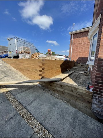 Driveway, sleeper walls and oak porch