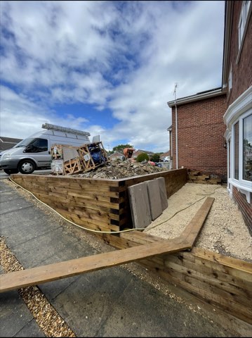 Driveway, sleeper walls and oak porch