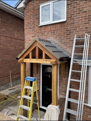 Driveway, sleeper walls and oak porch